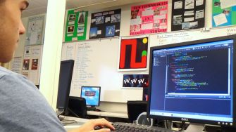 Senior Matt Berry programs through Minecraft, a specialized coding game, during workshop day, Oct. 14. 