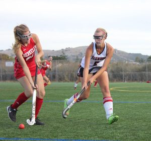 Junior Neeve Kennedy fights for the ball in the seasons final game.