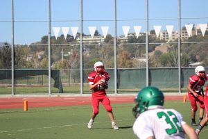 Redwood Giant #12, Louis Commesso, awaits an open receiver for a pass