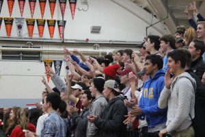 The Redwood fans cheer after a Redwood three-pointer.