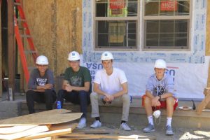 Teen Service Corps members take a break while volunteering at the Habitat for Humanity worksite in Novato.