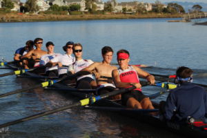 The boys' varsity rowing team practices for the upcoming Head of the Charles Regatta. A major reason for their success over the past decade has been the sense of community within the program.