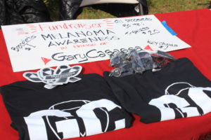 T-shirts, bracelets and keychains were sold at the game to support melanoma research and awareness.