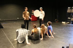 The cast of the Lenaea Festival rehearse the play together. 