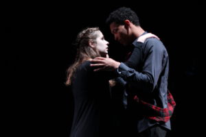 Juniors David Simpson-Heil (playing Macbeth), and Zoe Grandy (playing Lady Macbeth) embrace.