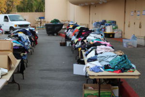 Piles of donated clothing sorted outside of the Marin County Civic Center, an evacuation center for the fire refugees. 