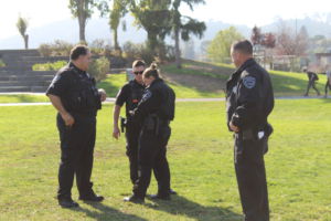 Discussing today’s plan, four Central Marin police officers gather on the South Lawn.