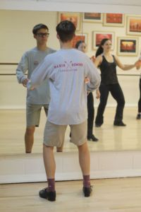 Following the moves of his instructor, John continues to advance his capabilities as a dancer. 