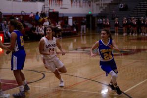 Freshman Kylie Horstmeyer rushes to gain position on defense