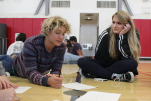 Sophomore Edvard Messler and Senior Desi D’Ancona talk during the ‘Two Truths and a Lie’ group game.