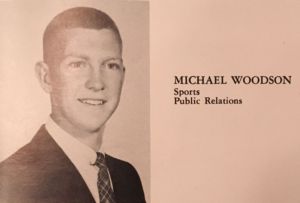 Smiling, Michael Woodson poses for his senior year yearbook photo in the 1959 Redwood Log. 