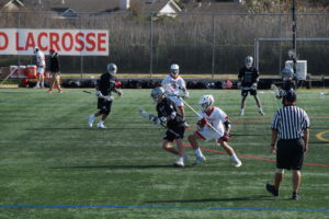 Junior Nick Piedimonte aggressively attempts to get the ball from the opposing team.