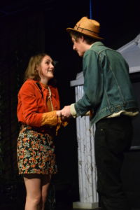 Hermia (Olivia Ray) discusses their plan to run away with Lysander (Ryan Bell)
