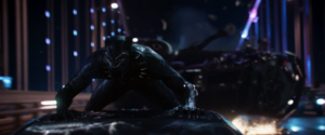 The Black Panther pursues Ulysses Klaue from the top of a car 
