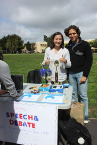 Isabella Liu (left) promotes the Speech & Debate club during Club Day as a senior.
