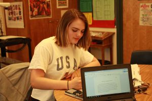 Senior Avrelle Harrington works on her final AP research presentation.