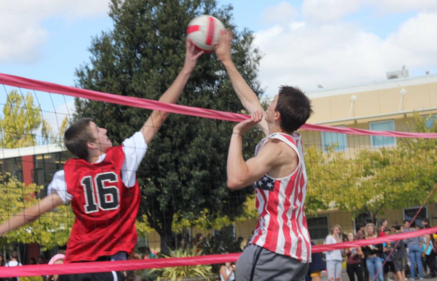 Peter Kennedy blocks a kill from Tyler Jackson in Mondays intramural volleyball game.