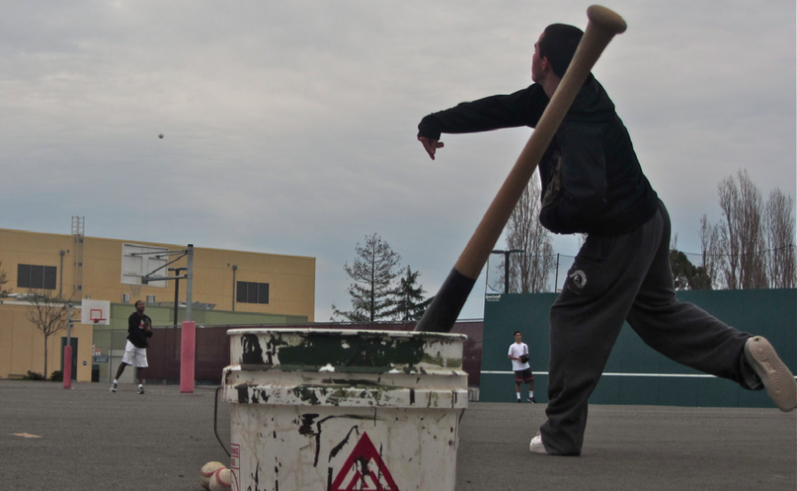 Junior Zak Lyons plays catch during an offseason baseball practice. 