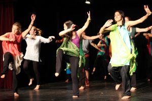 The Dance Focus night class performs on stage in the Little Theater.