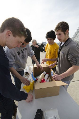 FROM LEFT TO RIGHT, science students Peter Mascheroni, Lorenzo Cico, Andrew Westle, and Ezra Hoffman assemble their rocket before launching at the NASA Research Center’s Moffett Field. 
