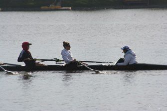 SENIORS BRIDGET KONTINNEN and Megan Oechsel (left to right) row along with coxswain Jill Berling at a recent Marin Rowing practice. The varsity girls had two victories over the Oakland Strokes earlier this month.