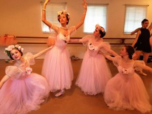 SOPHOMORE DAPHNE NHUCH(second from right) practices during a dress rehearsal for Marin Ballet's anniversary performance