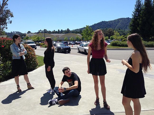 Seniors rehearse in front of the Little Theater in preparation for the April 18 performance. 