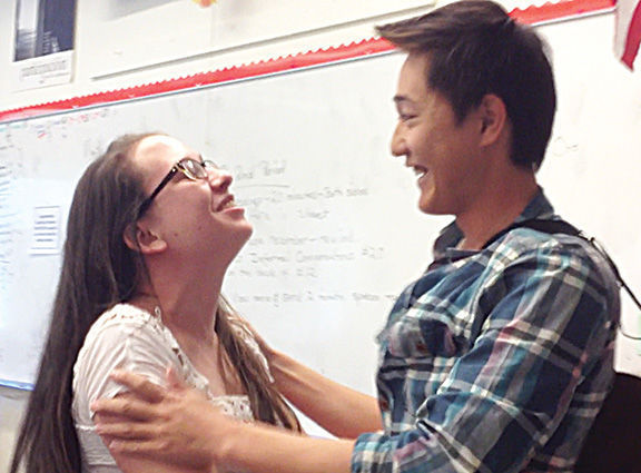 SENIOR YODAI YASUNAGA embraces his Prom date, senior Jenny-Marie Stryker, after performing his cover of Bruno Mars’s “Marry You” for her during her AP Spanish class.