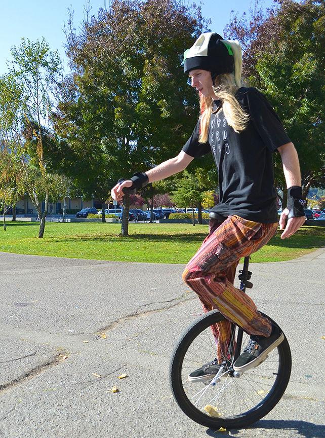 Senior Devon Jenkins unicycles through Redwood in his iconic jester hat on Saturday afternoon.