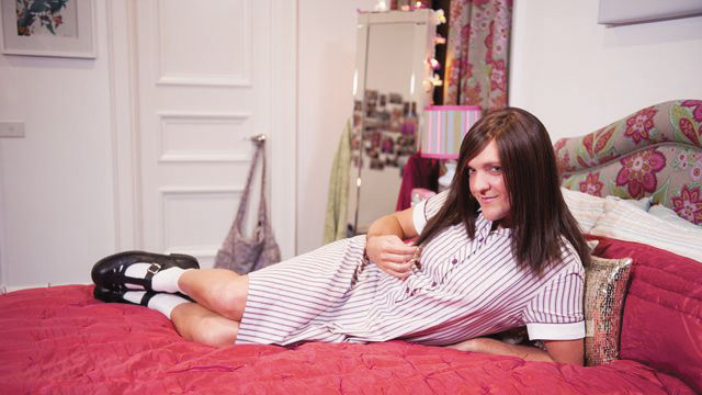 LOUNGING PROVACATIVELY on her bed, Ja’mie, played by 39-year-old comedian Chris Lilley,  stares into the camera in the mockumentary, Ja’mie Private School Girl.