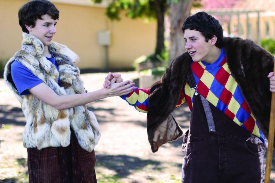 James Harding, the clown in The Winter’s Tale production, explains to his shepherd father, played by Leo Zaklikowski (right), that he discovered a baby and a bunch of gold in the woods in a rehearsal in the Quad.