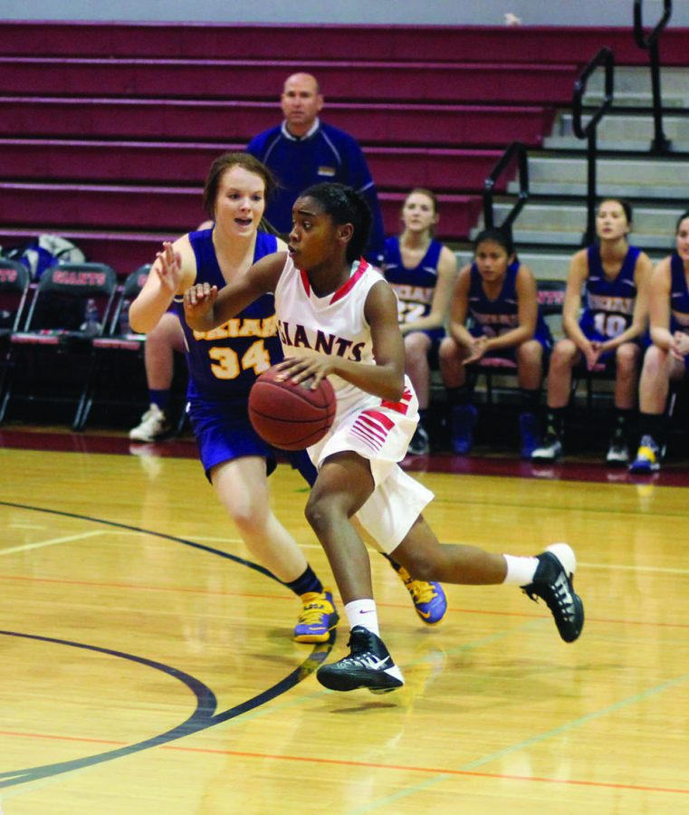 Freshman Jaiana Harris drives towards the basket in an attempted lay-up