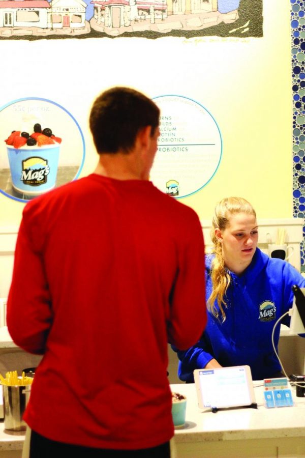 Redwood student Katherine Grellman serves a student at Mags Local Yogurt in downtown Larkspur