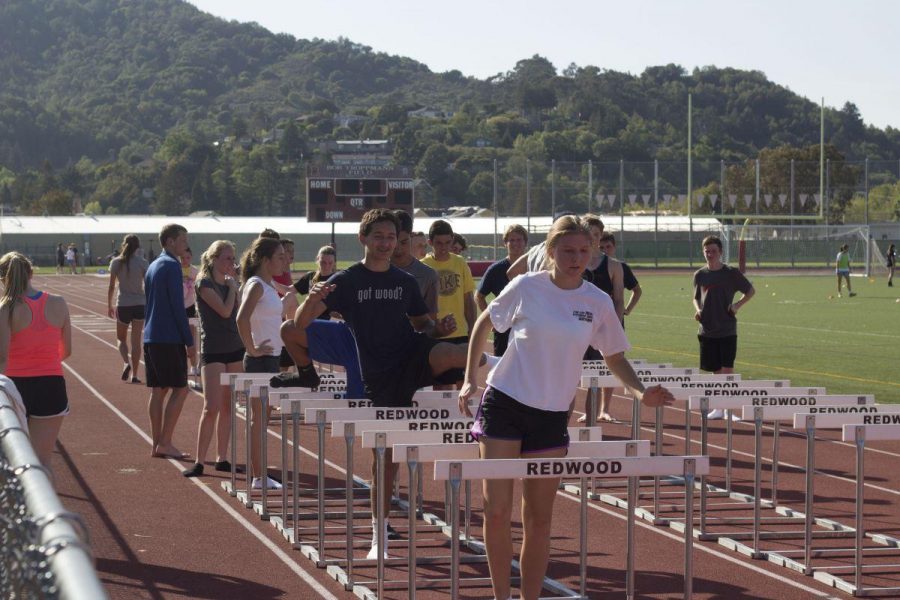 RUNNERS PRACTICE HURDLING on the track on Monday, March 24.