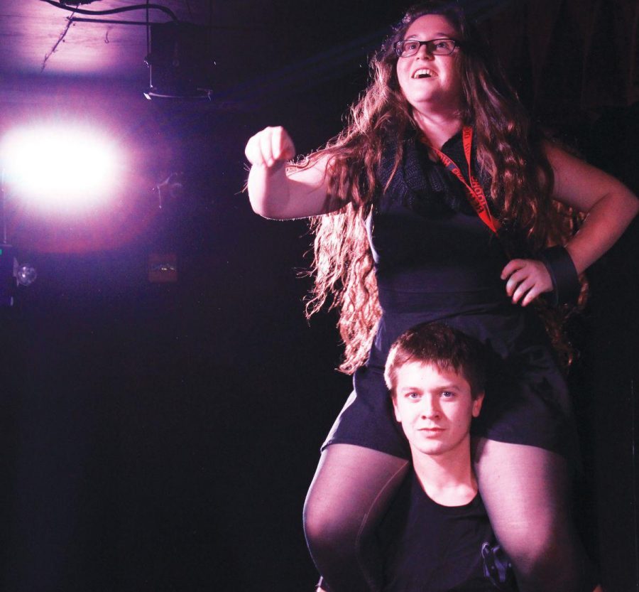 Senior Tom Cline holds Leah Cohen on his shoulders before Winters Tale in March.