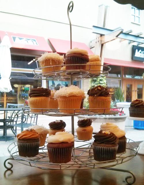 Teacake Bake Shop, located in Corte Madera Town Center, displays their cupcake options in the storefront window. Each cupcake costs $3.75. 