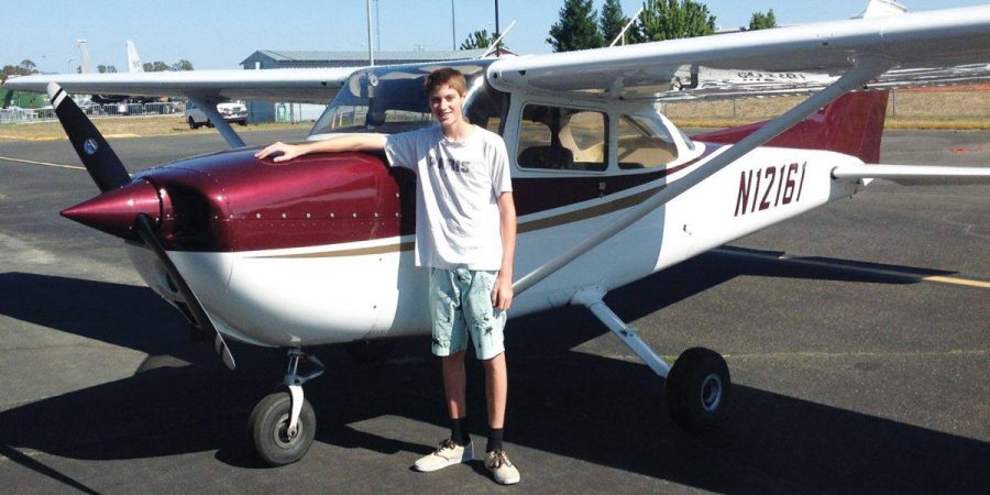 Junior Aaron Cary stands next to his plane in Santa Rosa. With five more hours  of air time, he will meet his quota to obtain his private pilot’s license.