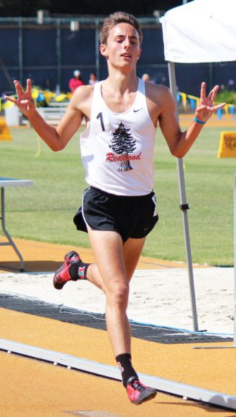 Senior Fred Huxham crosses the finish line in first place in the 3200 meter run at Meet of Champions last Saturday.