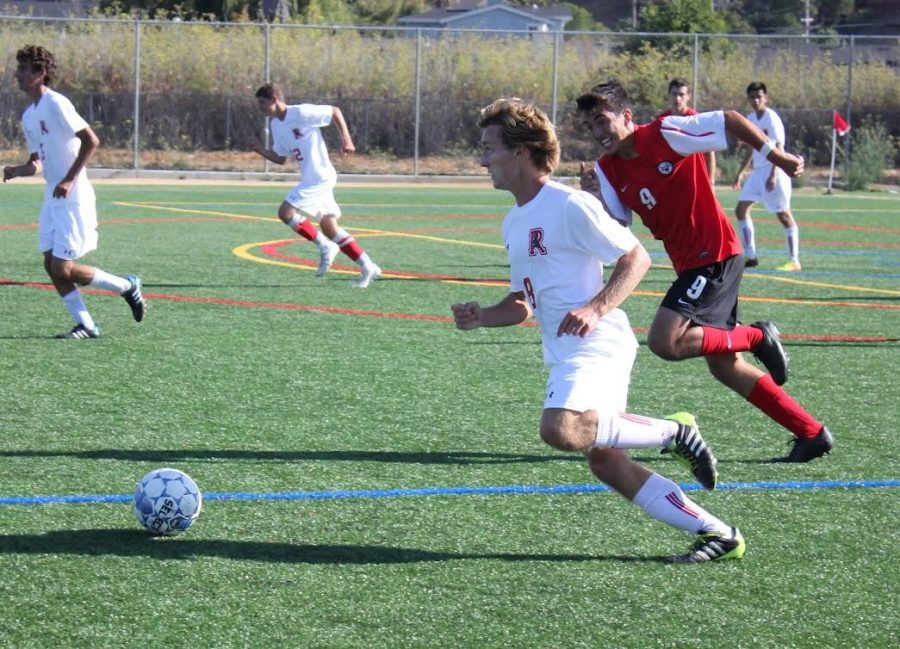 Junior Isaac Perper dribbles the ball during Wednesdays game versus Marin Academy.