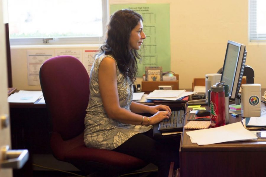 Redwoods new Wellness Director Jessica Colvin works at her desk. 