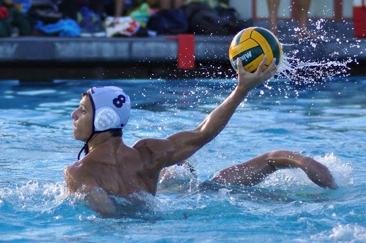 Captain Giorgio Cico winds back for a powerful pass up the pool. 