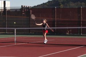 Freshman Rose Cabi competes in the varsity tennis match on Thursday, Oct. 2. 
