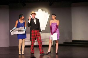 Junior Naina Vyas, senior Nick Schwager, and junior Stephanie Poore rehearse on Oct. 7 for Animal Crackers. The show, which opened Oct. 8, is the first Marx brothers show that Redwood has ever performed. 