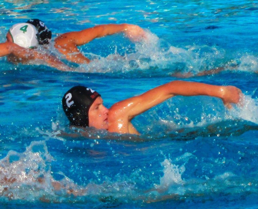Junior Cole Porter quickly swims to make a play. 