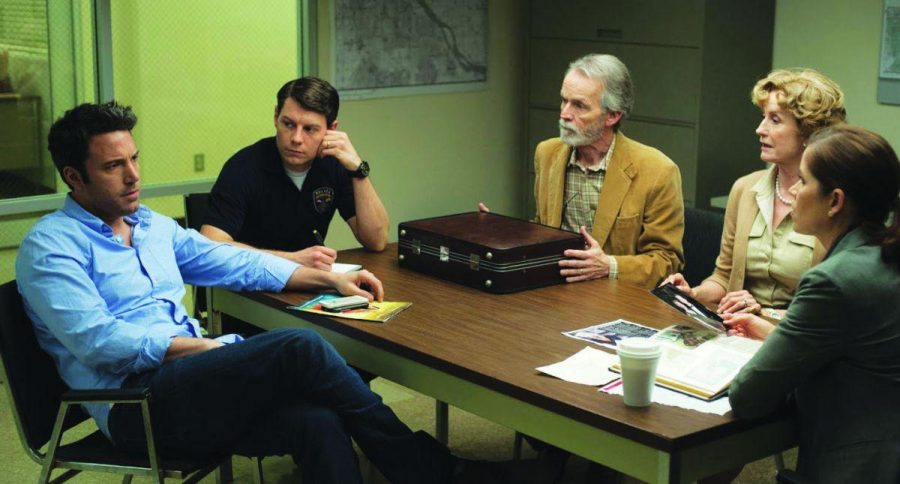 NICK DUNNE (Ben Affleck) is interrogated by police about the mysterious circumstances surrounding the disappearance of his wife Amy (Roasmund Pike) in the film “Gone Girl”.