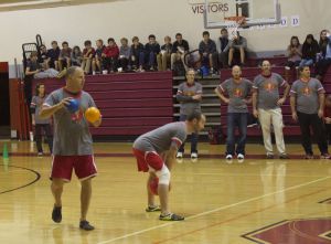 Socially studies teacher, Jon  Hirsch prepares to throw the ball at his opponents.