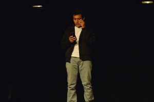 Senior Oscar Mogollon recites his slam poem at the slam poetry auditions in the Little Theater. 