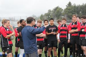 Tom Billups, the former U.S. national rugby team head coach  instructs the team before they begin doing drills.  