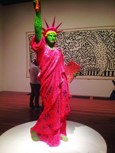GREETING VISITORS as they walk into the Keith Haring exhibit, this statue stands proudly. The exhibit will be at the DeYoung until Feb. 16.
