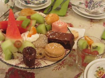 Brownies, assorted fruits, and pastries are delightfully served in the 